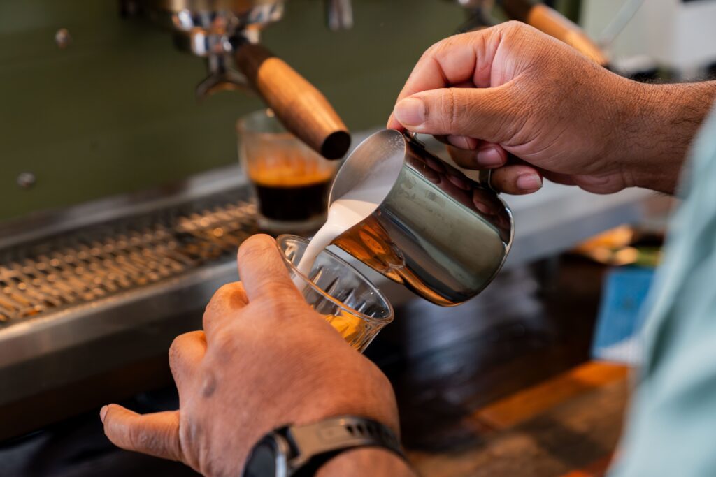 Dog-friendly café in Sydney with coffee bar, fresh pastries, and dog mural wall art, creating a welcoming spot for pet owners.
