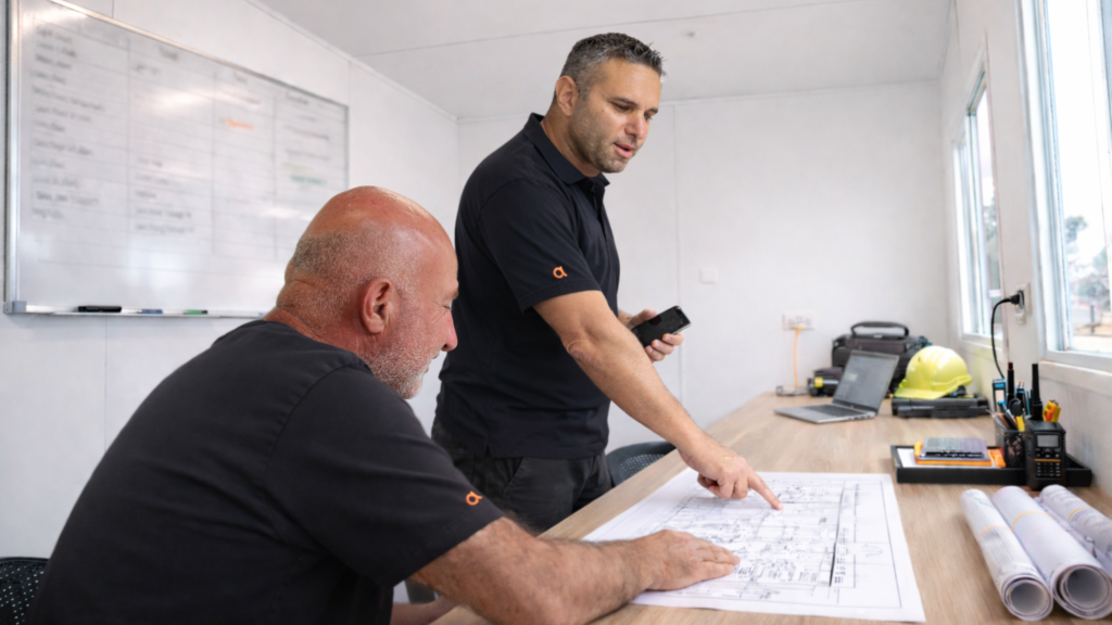 arriva maintenance staff looking at a blueprint