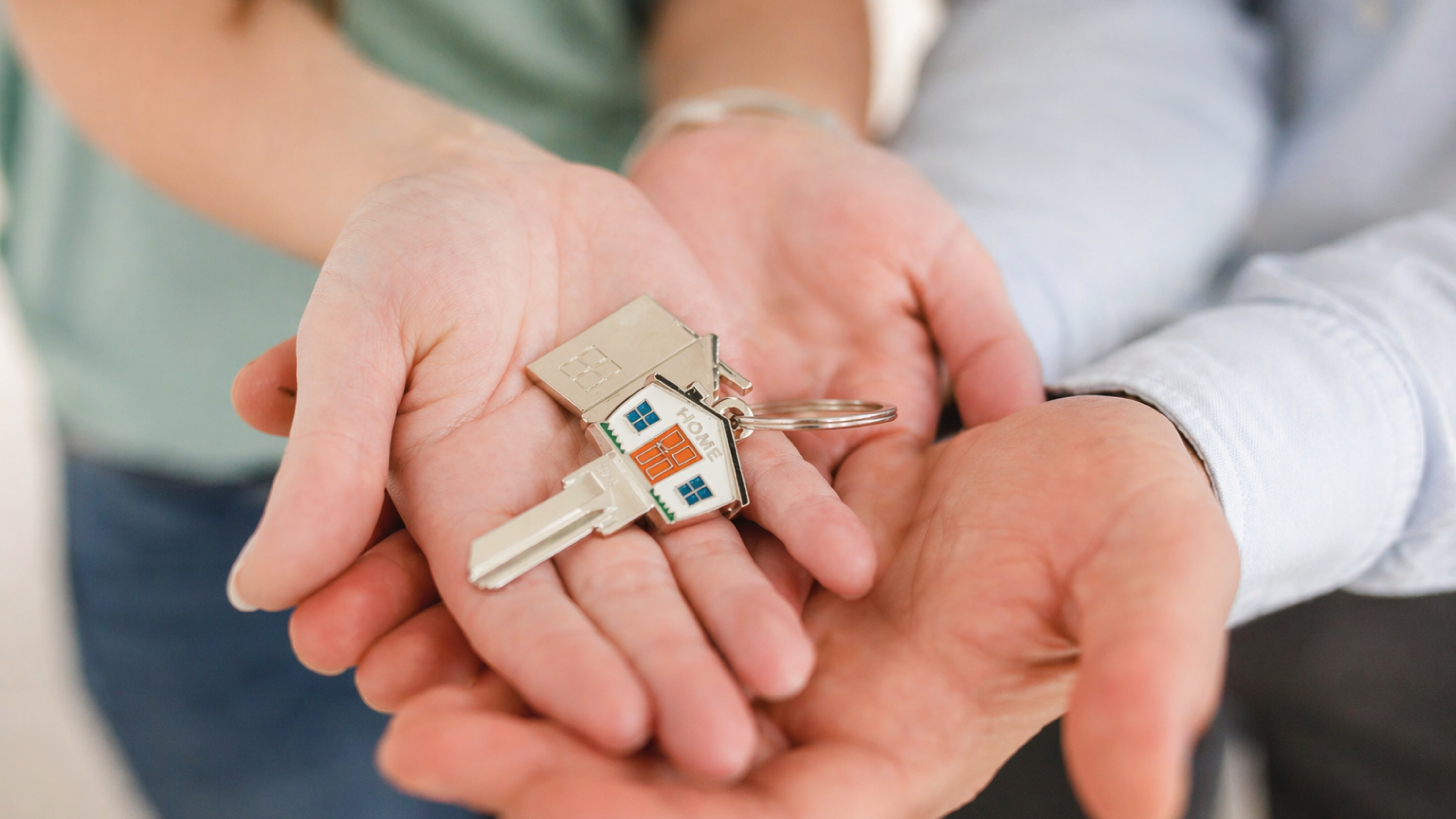 A couple holding a house key