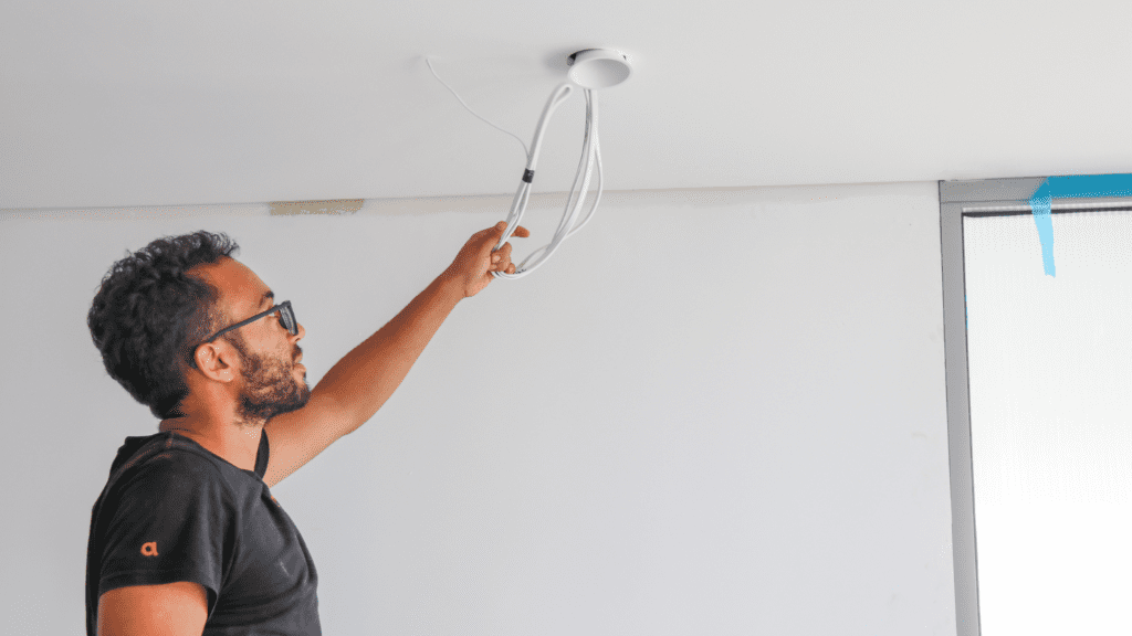 a handyman working on electrical repairs